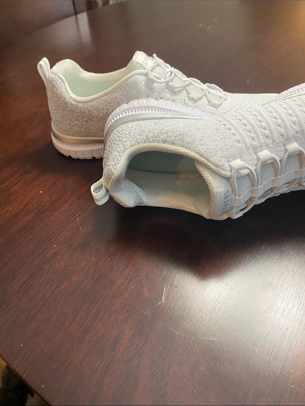 Skechers Women's All-White Slip-On Knit Athletic Sneakers - Picture 2 of 6
